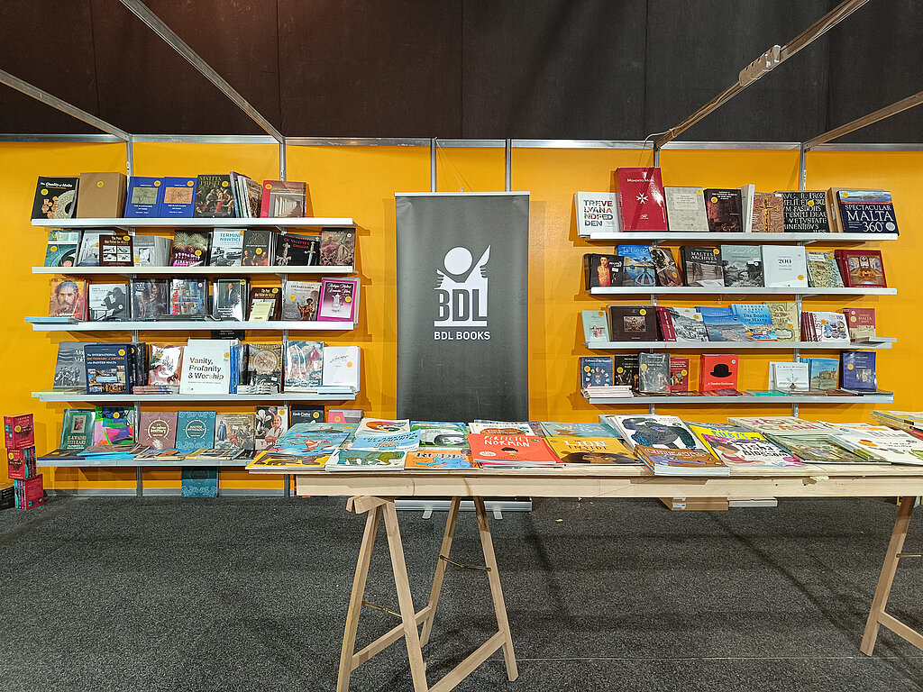 Book exhibition with table and shelves